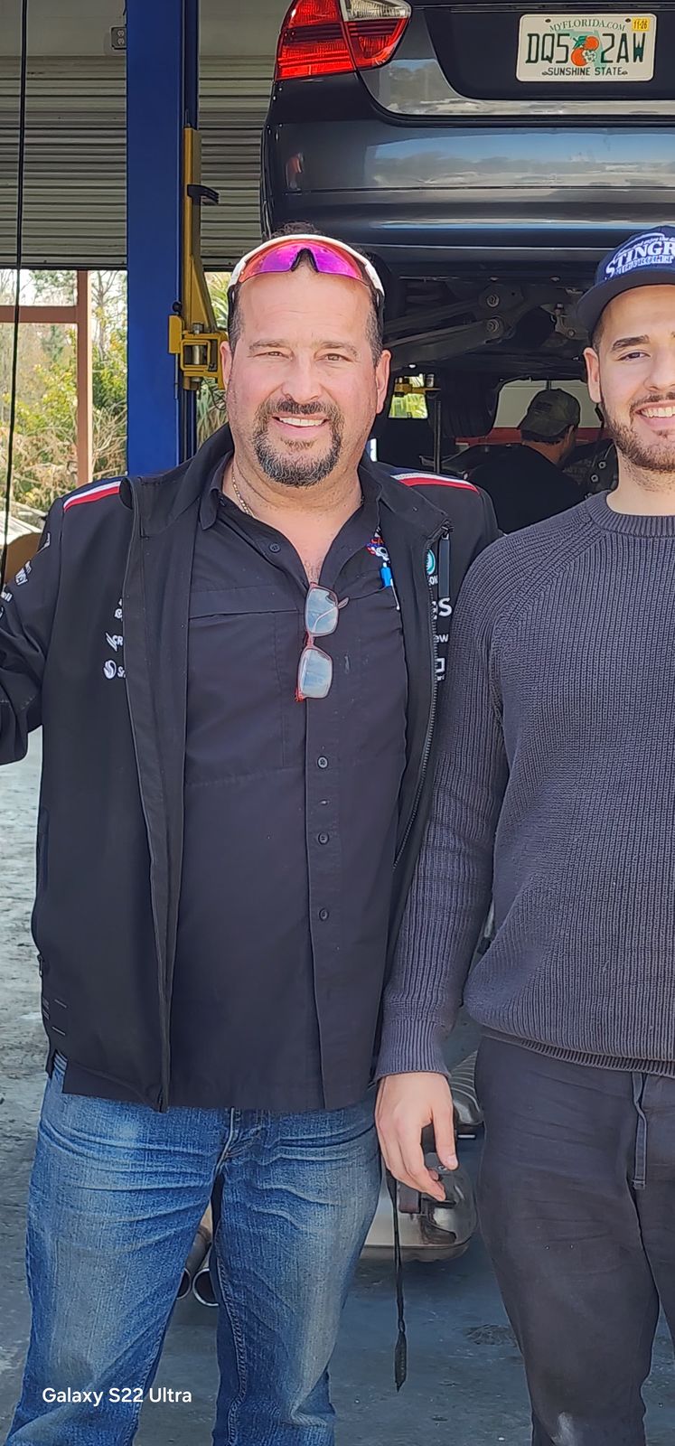 Claudio Canete and a technician at the shop