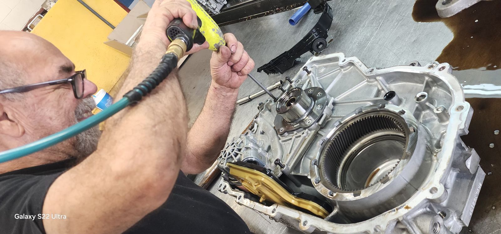 Claudio working hands-on inside a transmission